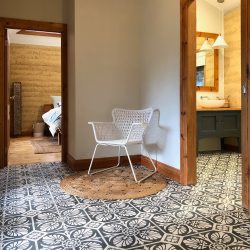 Handmade HOJA encaustic tile of old Spanish design in gunmetal blue and white has a laid-back, casual vibe - bathroom floor cottage installation - Rever Tiles.