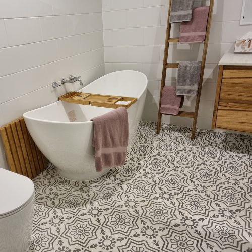 Rever Tiles | AZTEC-003.2 | Encaustic Tile Bathroom Design. Add flare to an otherwise neutral room and create a beautiful feature floor with our Aztec-2 encaustic tile in contrasting silver on white.